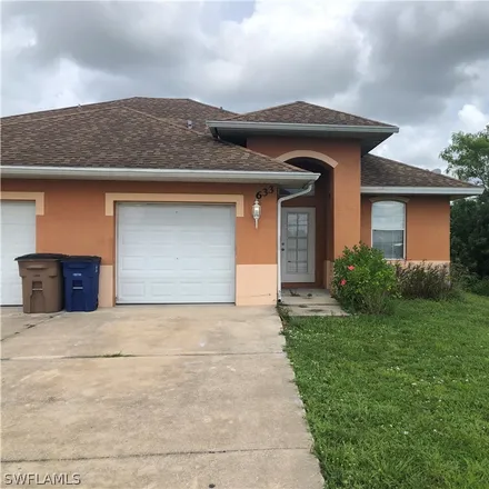 Rent this 3 bed house on 633 Alabama Road South in Lehigh Acres, FL 33974