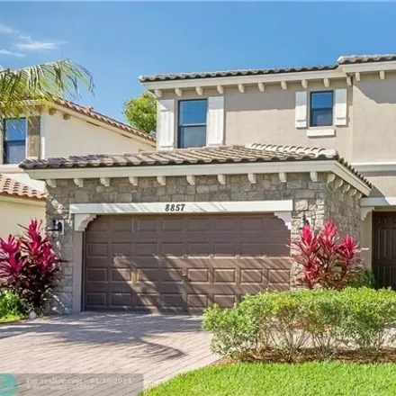 Rent this 5 bed house on 8857 Willow Cove Ln in Lake Worth, Florida