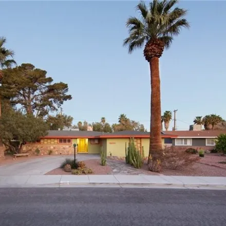 Rent this 4 bed house on 1640 Houssels Avenue in Las Vegas, NV 89104
