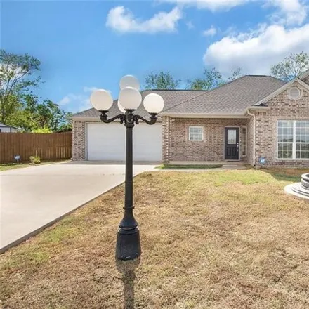 Buy this 4 bed house on Olde Oaks Circle in Madisonville, TX