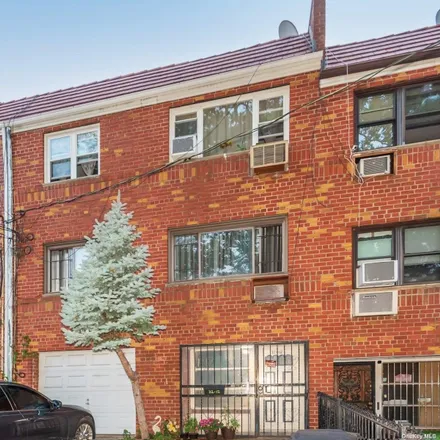 Buy this 4 bed townhouse on 32-06 75th Street in New York, NY 11370