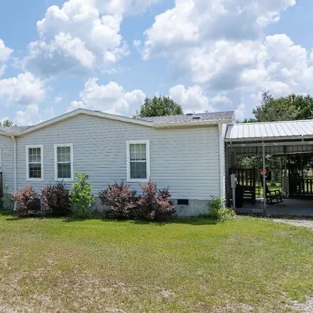 Buy this studio apartment on 231 Southwest Federal Court in Columbia County, FL 32038