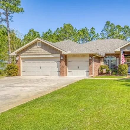 Buy this 5 bed house on 6844 Leisure Street in Navarre, FL 32566