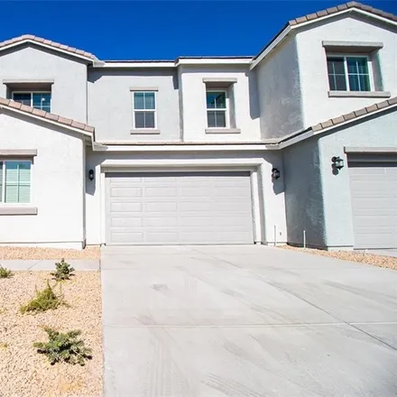 Rent this 4 bed townhouse on 2519 Rainy Meadows Avenue in North Las Vegas, NV 89031