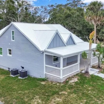 Buy this 4 bed house on 1720 Magnolia Street in New Smyrna Beach, FL 32168