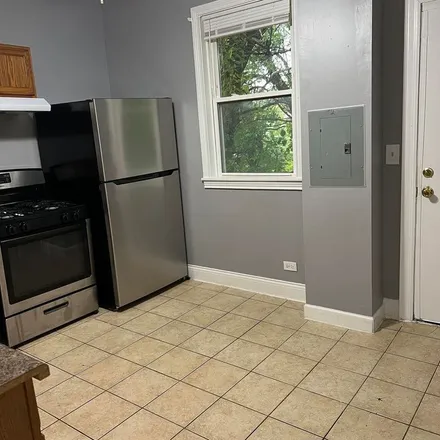 Rent this 3 bed apartment on 7714 South Loomis Boulevard in Chicago, IL 60620