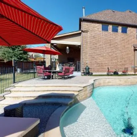 Buy this 4 bed apartment on 7219 Canadian Drive in Riverside Village, Irving