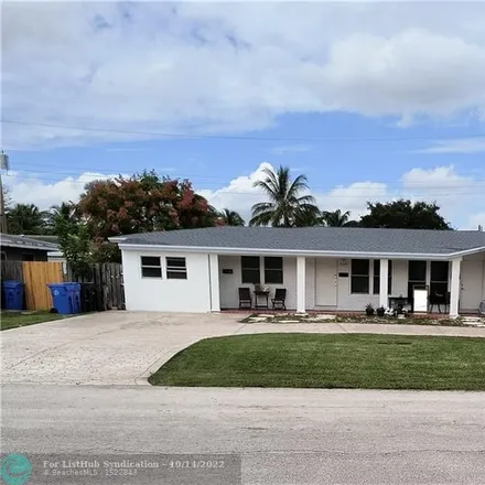 Buy this 4 bed house on Bomb Squad Pooper Scooper in Northeast 54th Street, Coral Ridge Isles