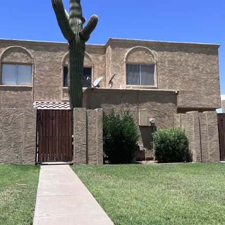 Buy this 2 bed townhouse on West Emelita Circle South in Mesa, AZ 85210