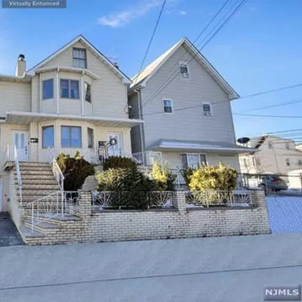Rent this 4 bed house on 91 Arnot Street in Lodi, NJ 07644