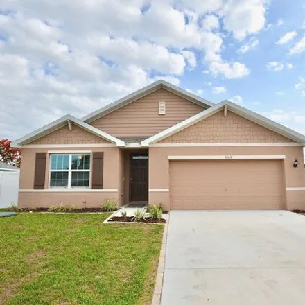 Buy this 4 bed house on 1065 Southwest McCracken Avenue in Port Saint Lucie, FL 34953