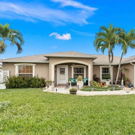 Buy this 3 bed house on 313 Southwest Dustin Avenue in Port Saint Lucie, FL 34953