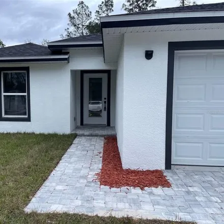 Buy this 3 bed house on 1374 10th Ave in Deland, Florida