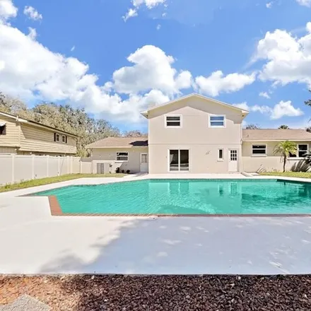 Buy this 4 bed house on 11910 Riverhills Dr in Tampa, Florida