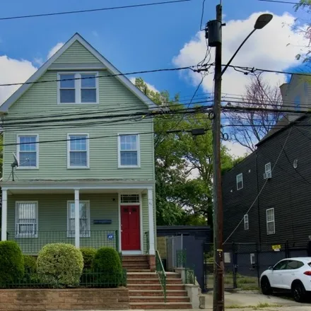 Rent this 2 bed townhouse on 84 South Devine Street in Newark, NJ 07106