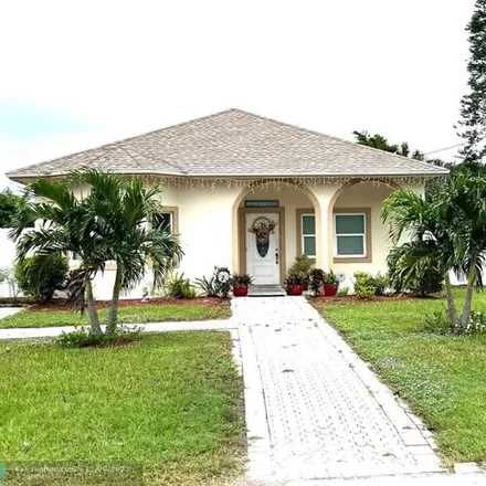 Buy this 3 bed house on 4401 Palm Avenue in Palm Beach County, FL 33406