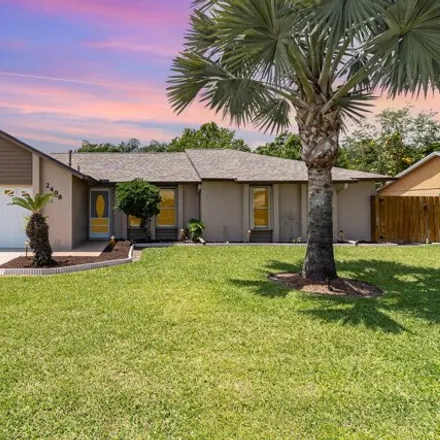 Buy this 3 bed house on 2430 Woodsmill Drive in Melbourne, FL 32934