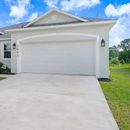 Buy this 4 bed house on 331 Latham Street Southeast in Palm Bay, FL 32909