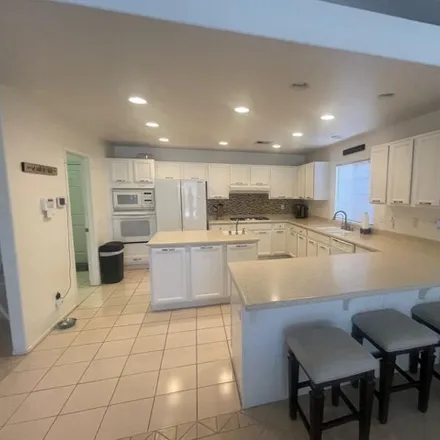 Rent this 4 bed house on 79533 Morning Glory Court in La Quinta, CA 92253