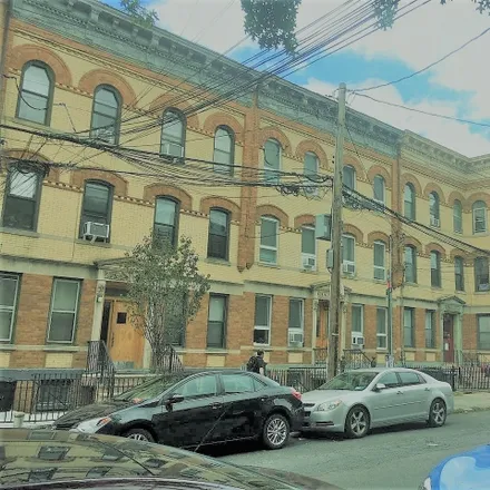 Buy this 12 bed townhouse on 60-20 Putnam Avenue in New York, NY 11385