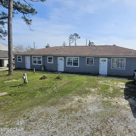Buy this 6 bed house on 715 W 13th St Unit 1-3 in Panama City, Florida
