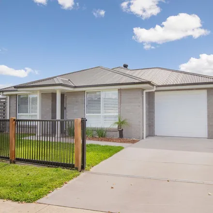 Rent this 4 bed townhouse on 12 Emperor Parade in Chisholm NSW 2322, Australia