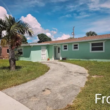 Rent this 4 bed condo on 1168 West 23rd Street in Riviera Beach, FL 33404