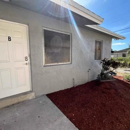 Rent this 3 bed house on 564 Avenue I in Riviera Beach, FL 33404
