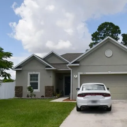 Buy this 4 bed house on 1055 Southwest Longfellow Road in Port Saint Lucie, FL 34953