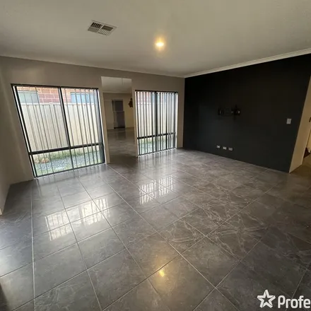 Rent this 4 bed apartment on 32 Silverthrone Road in Haynes WA 6112, Australia