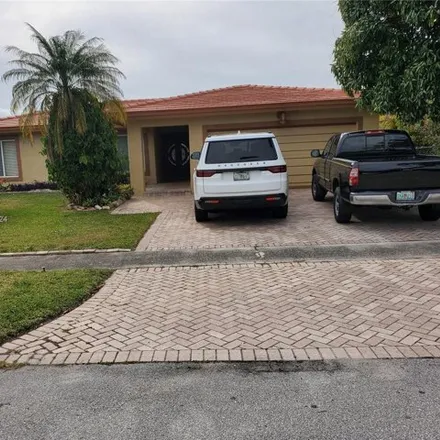 Buy this 4 bed house on 8217 Northwest 68th Avenue in Tamarac, FL 33321