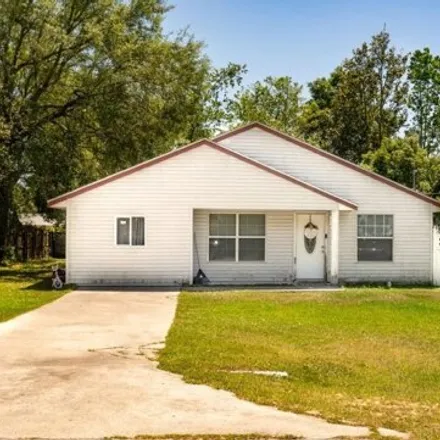 Buy this 3 bed house on 21692 Southwest Honeysuckle Street in Marion County, FL 34431