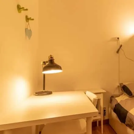 Rent this 7 bed room on Rua de Ponta Delgada in 1000-243 Lisbon, Portugal