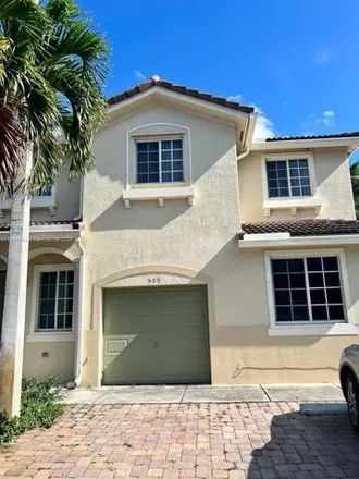 Rent this 4 bed townhouse on 21433 Northwest 13th Court in Miami Gardens, FL 33169