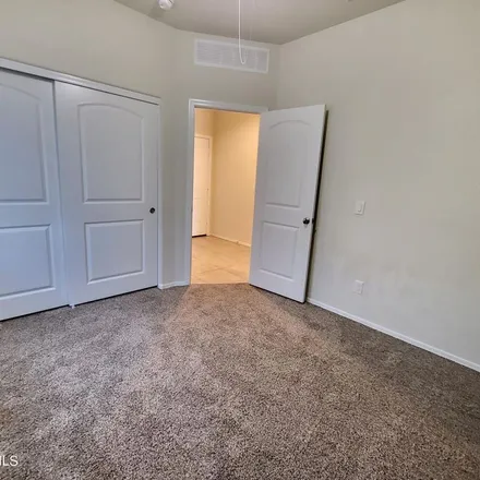 Rent this 3 bed apartment on North Saguaro Drive in Pinal County, AZ