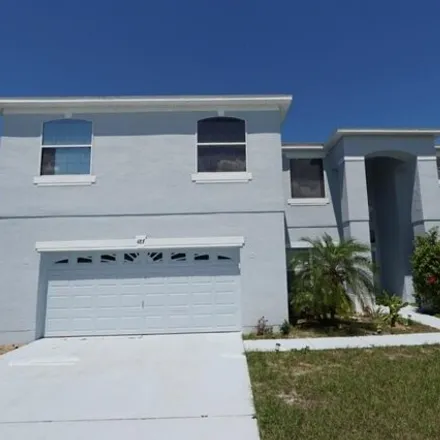 Rent this 4 bed house on 487 Big Sioux Ct in Kissimmee, Florida