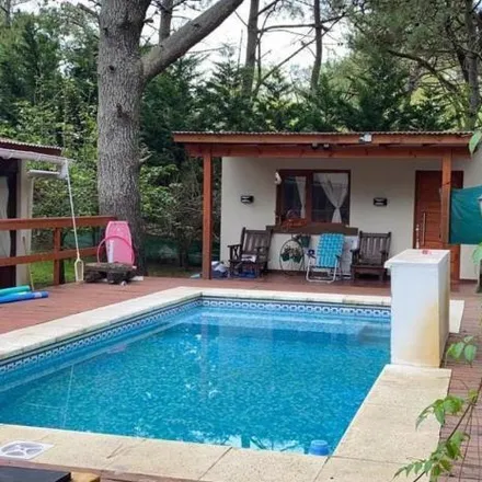 Buy this 4 bed house on Las Camelias 200 in Partido de La Costa, 7112 Costa del Este