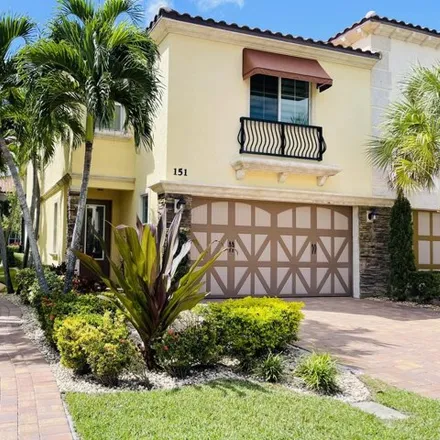 Rent this 3 bed townhouse on 151 Sword Fern Pl in Wellington, Florida