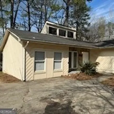 Rent this 4 bed house on 8573 Plumtree Drive in Riverdale, GA 30274