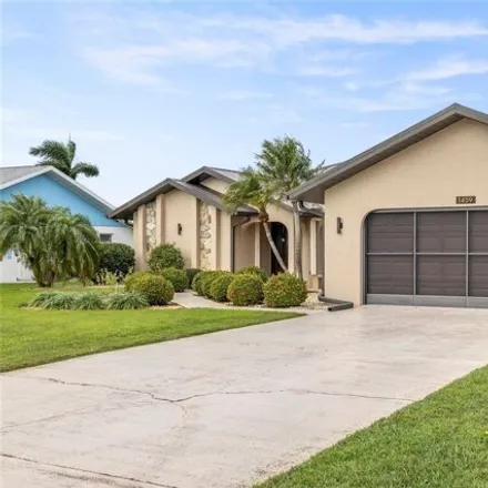 Buy this 3 bed house on 1457 Blue Lake Circle in Charlotte County, FL 33983