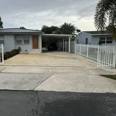 Buy this 3 bed house on 932 Bradley Court in West Palm Beach, FL 33405