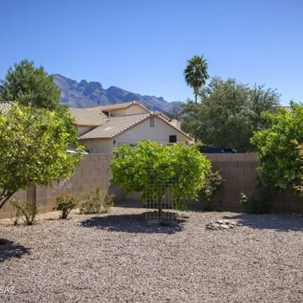 Buy this 4 bed house on 1504 West Dusk Glow Loop in Pima County, AZ 85704