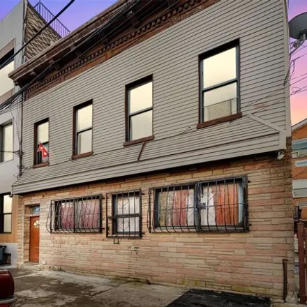 Buy this 8 bed house on 1016 Cypress Avenue in New York, NY 11385
