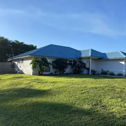 Rent this 3 bed house on 3190 Southwest Areca Drive in Palm City, FL 34990