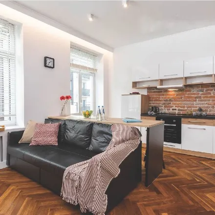 Rent this 2 bed apartment on Wspólna 54A in 00-684 Warsaw, Poland