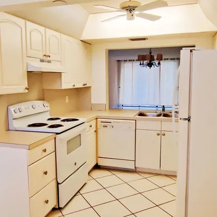 Rent this 3 bed apartment on 1800 Homewood Boulevard in Rainbow Homes, Delray Beach