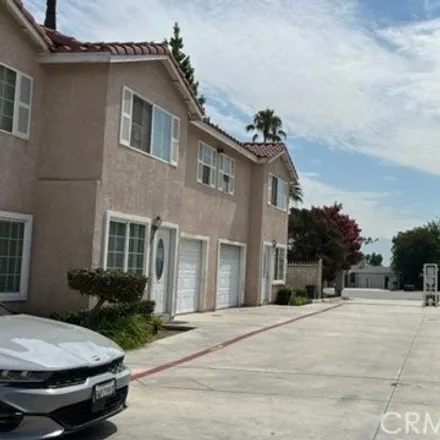 Rent this 3 bed townhouse on 992 South Riverside Avenue in Rialto, CA 92376