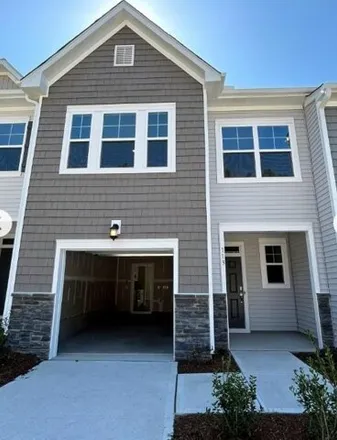 Rent this 3 bed townhouse on Vanilla Orchid Lane in White Oak, Wake County