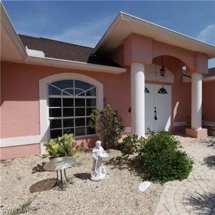 Rent this 4 bed house on 1261 Northeast 3rd Terrace in Cape Coral, FL 33909