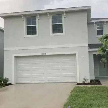 Rent this 4 bed house on Spanish Rose Drive in Dade City, FL 33525